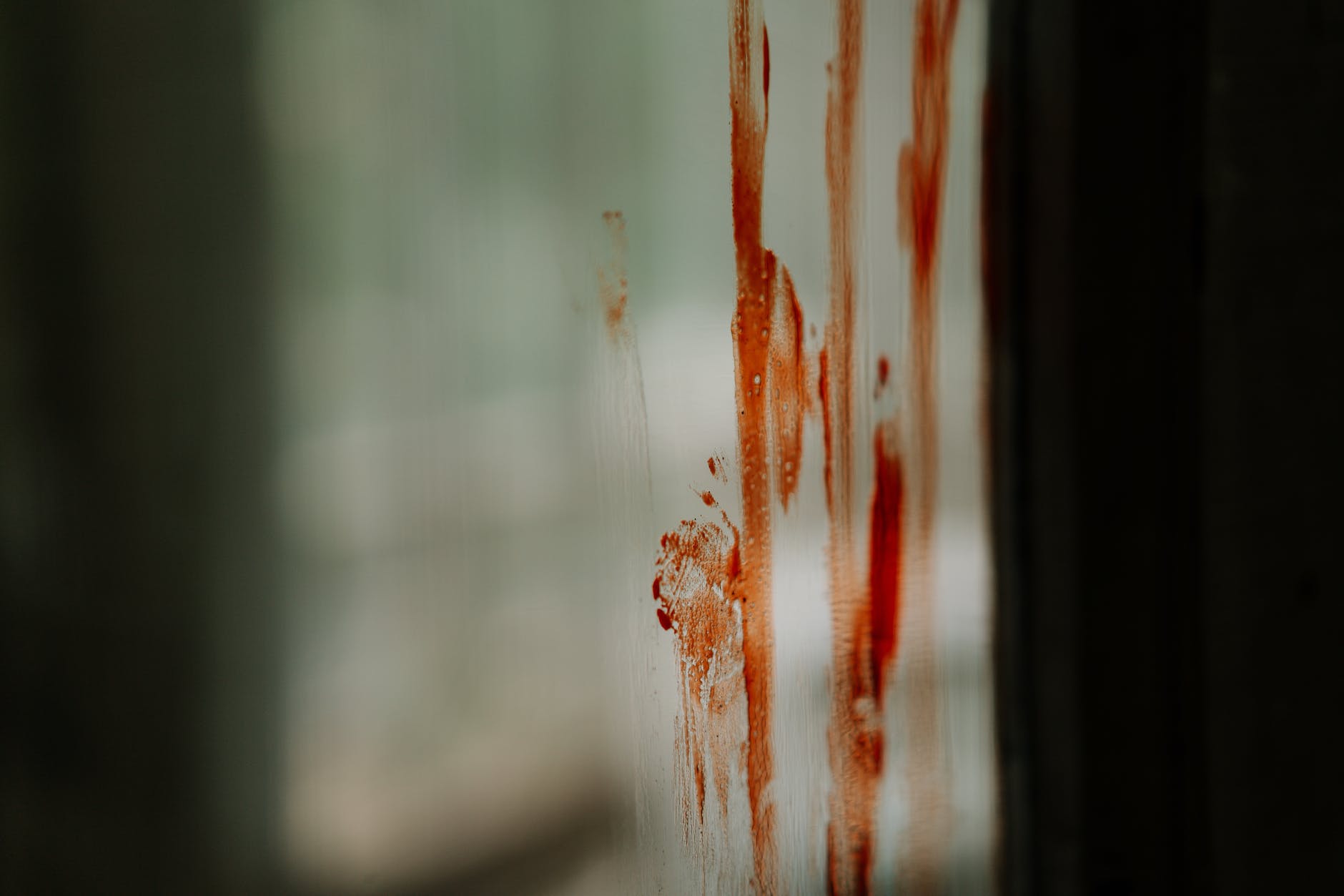 blood stains on glass panel